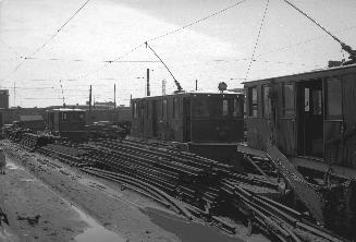 T.T.C., #s S-21, S-23 & S-24, sweepers, being scrapped at George St. yard, looking southwest across Esplanade E