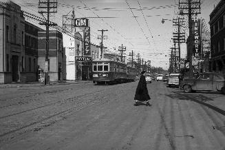 Yonge Street looking north from Broadway Avenue. Image shows a street view with a street car al ...