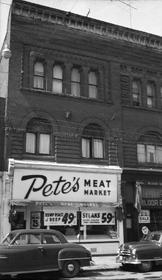 Historic photo from 1953 - Pete's Meat Market - with horse head between windows (currently the Black Horse Restaurant and Bar) in Dovercourt Park