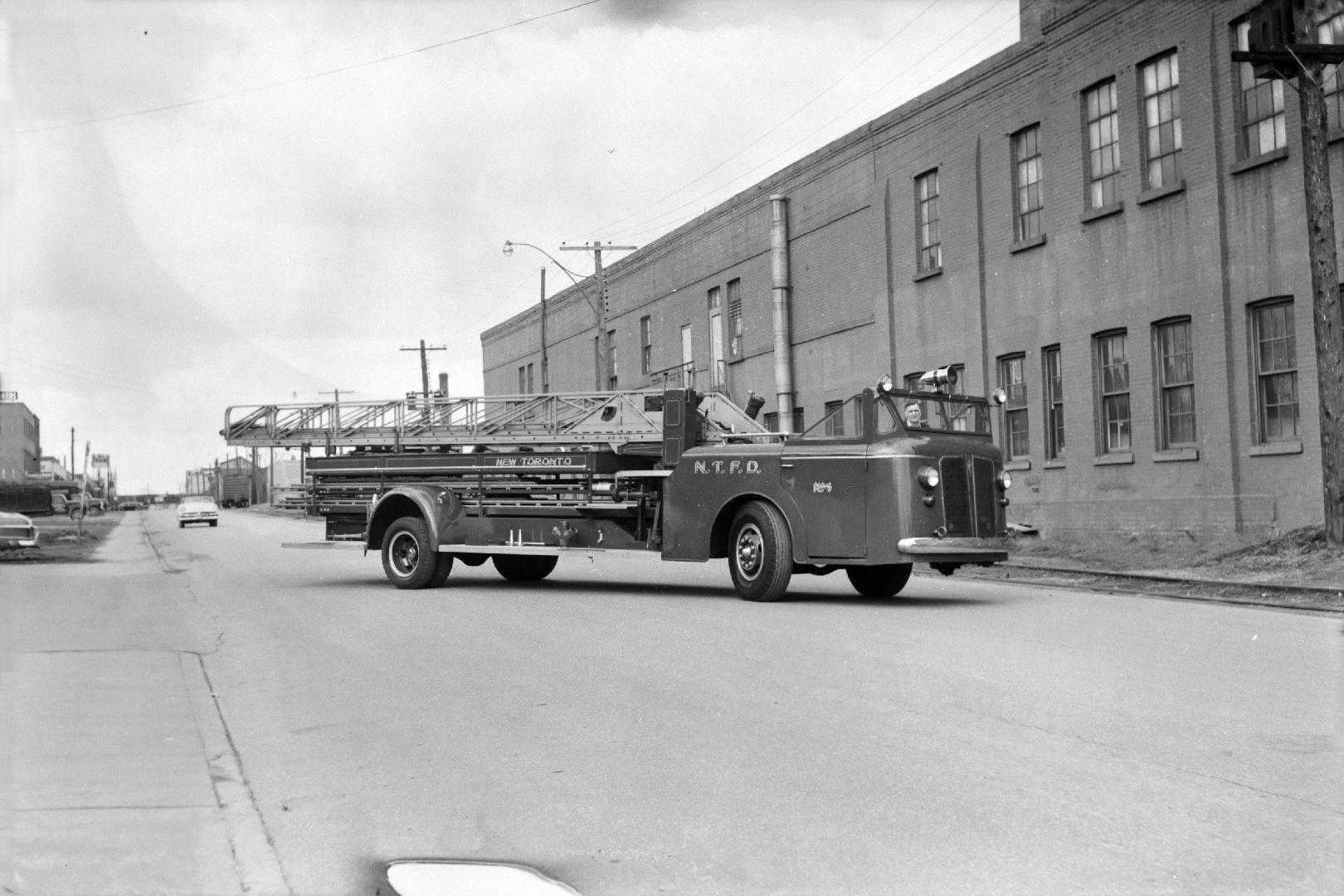 New Toronto Aerial No. 4, in front of fire hall, Eighth St., west side, north of Lake Shore Boulevard W., looking north