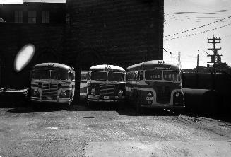 Gray Coach Lines, bus, at T.T.C. Sherbourne Garage, looking south showing garage, formerly T.R.C. motor shops, in background