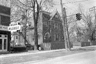 Historic photo from Wednesday, April 13, 1955 - Brown Public School, later a Magistrate's Court (Willow Florist to the south - Daffs 69 cents) in Willowdale