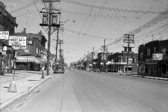 Yonge St., looking north from south of Woburn Ave. Image shows Yonge street with houses along b ...