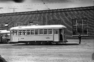 Image shows a work car on the tracks.