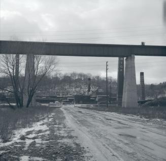 Historic photo from Sunday, December 25, 1955 - Looking under the railway bridge west across the Don Valley Brick Works with 4 smoke stacks in Don Valley Brickworks
