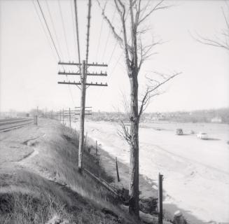 (The) Queensway, looking west beside Grenadier Pond during construction