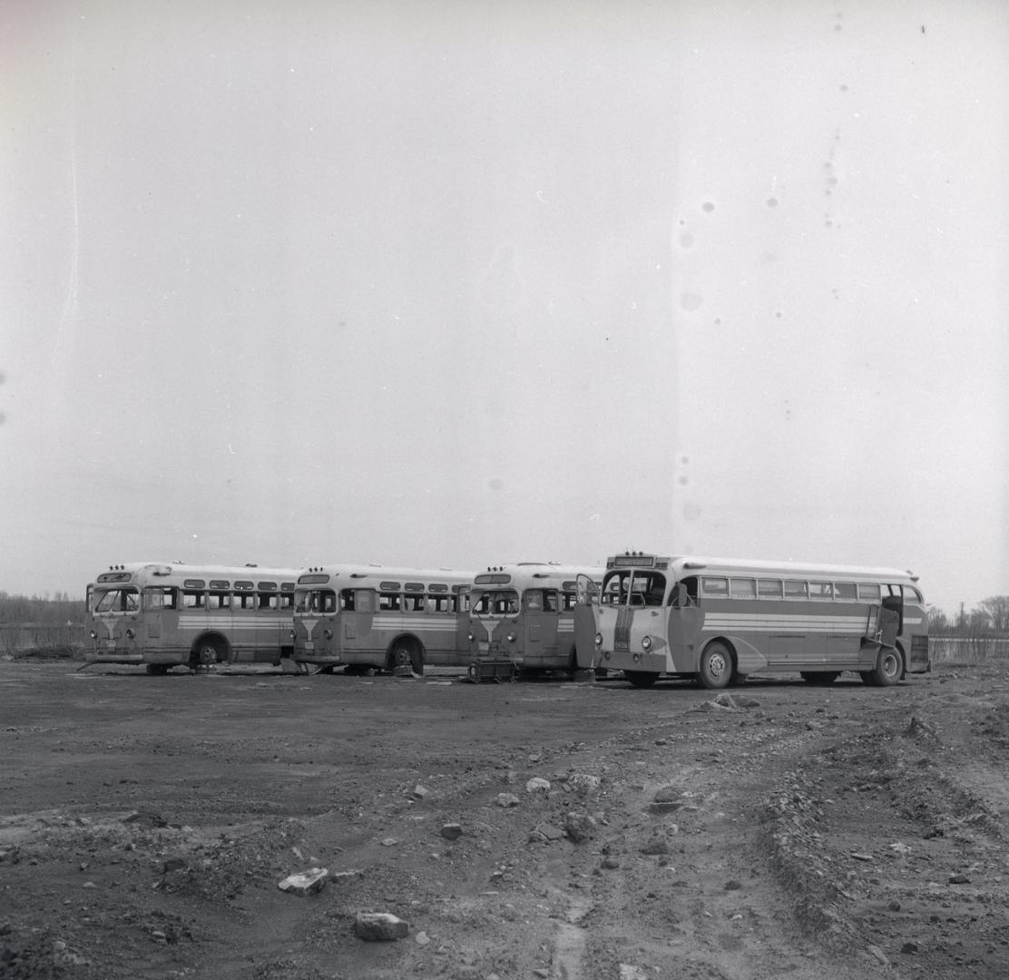 Gray Coach Lines, bus, on vacant lot at east end of Basin St