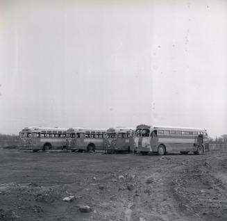 Gray Coach Lines, bus, on vacant lot at east end of Basin St