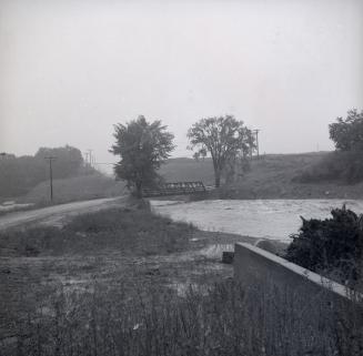 Islington Avenue, bridge over Humber River, looking south showing river in flood