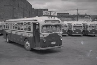 T.T.C., bus #930, at Sherbourne Garage, Sherbourne St., northwest corner Esplanade E., looking north to Front Street East