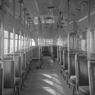 Image shows an interior of a rail car.
