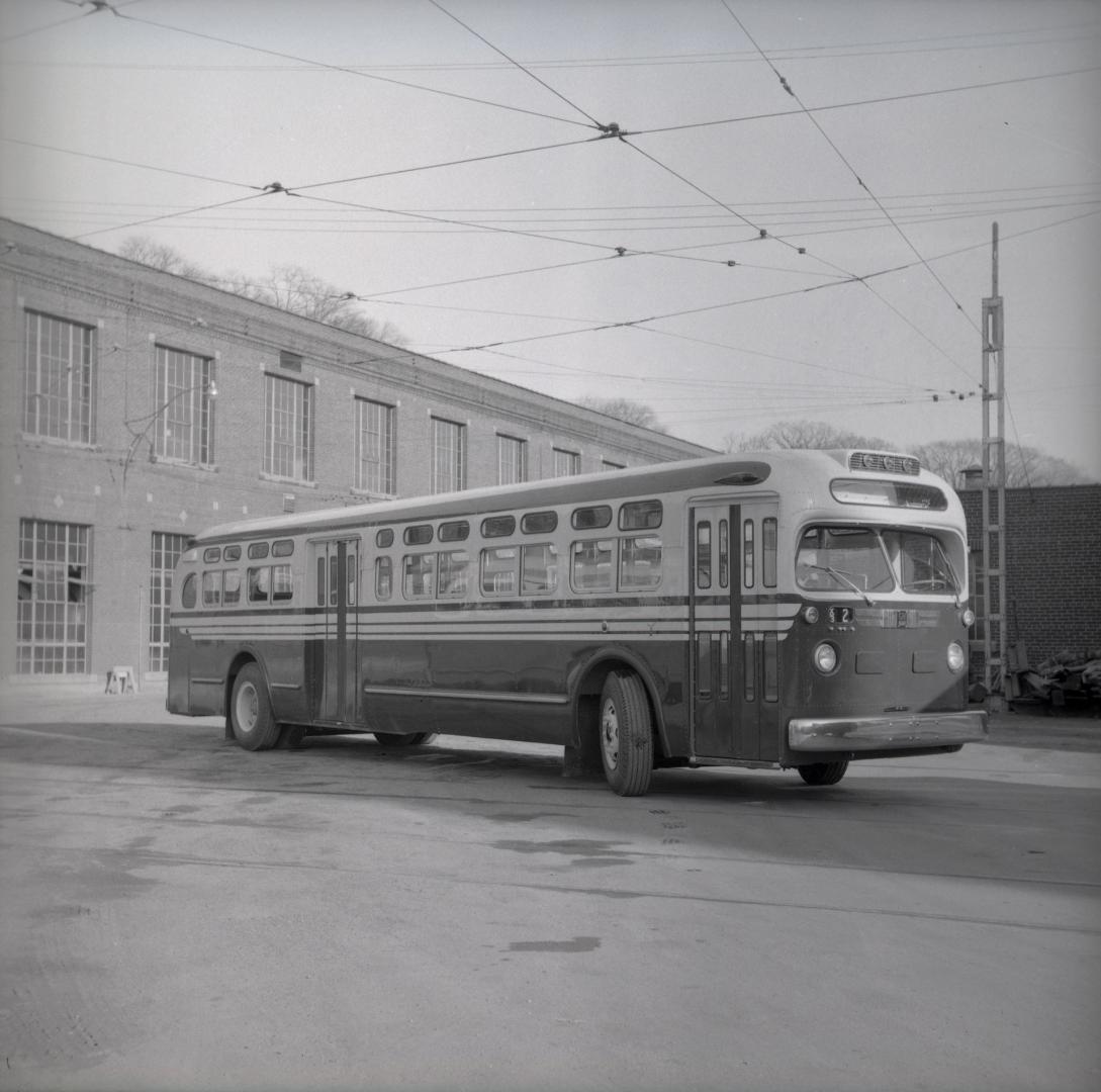  Image shows a bus by the building.
