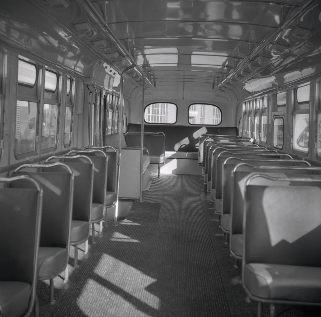  Image shows an interior of a bus.
