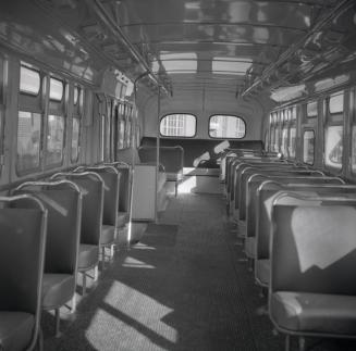  Image shows an interior of a bus.
