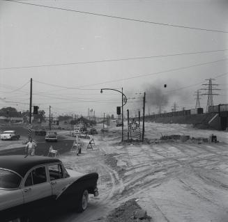 Lakeshore Boulevard W., looking southwest from The Queensway, during construction of Gardiner Expressway, showing approach to Queen Elizabeth Way
