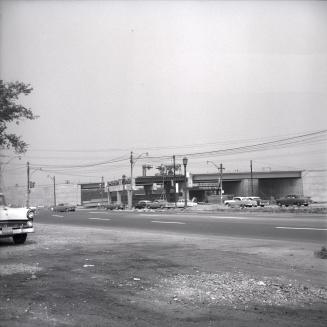 Lakeshore Boulevard W., looking northwest at Kingsway South, showing construction of Gardiner Expressway bridge over Kingsway South