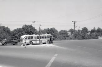 Hollinger Bus Lines, bus #82, on O'Connor Drive, looking north at Woodbine Avenue