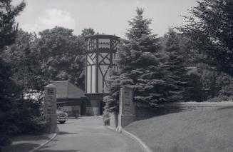Historic photo from 1954 - Gates, and stables with tower at Edgar A. Eaton, house, Blythwood Rd., s.w. corner Bayview Ave. in Lawrence Park