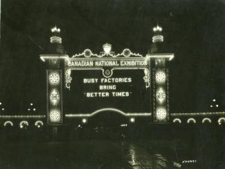 Historic photo from 1932 - Dufferin St. Gate - Busy Factories Bring Better Times - illuminated sign in CNE