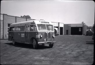 Hollinger Bus Lines, bus #16, at garage, Woodbine Avenue, southeast corner O'Connor Dr., looking east