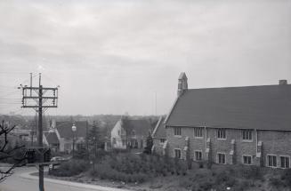 Bathurst St., looking southwest from Old Forest Hill Road bridge, showing Forest Hill United Church, Wembley Road, northwest corner Bathurst St., at right