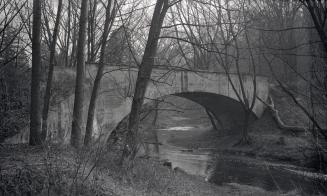 Image shows a bridge over the river.