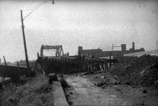 Old Weston Road., looking south from south of Monarch Road., showing construction of new north ramp to bridge over C.P.R. tracks