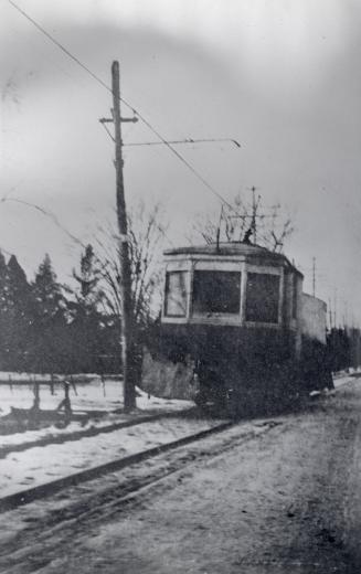 T.&amp; Y.R.R., Metropolitan line, Yonge St. Image shows a car on the tracks. 