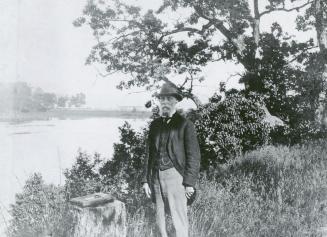Historic photo from 1910 - Portrait of John Ellis Jr, (1836-1923) on his Herne Hill estate, looking s.e. across Grenadier Pond in Swansea