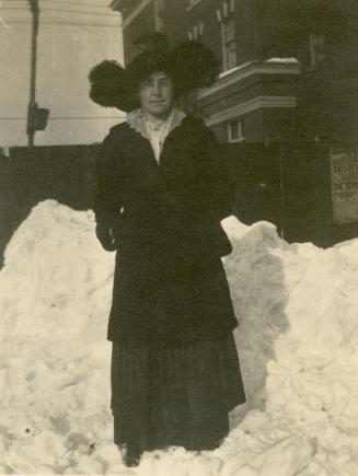 Empringham, Margaret L. (Westlake), with Empringham Hotel, Danforth Avenue, southwest corner Dawes Road., in background