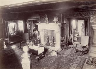 Historic photo from 1890 - Looking down from the stairs to fireplace and rugs - Benvenuto interior in South Hill
