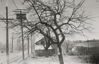 Yonge Street north of Lawrence Avenue; looking south. Image shows a two storey house behind the ...