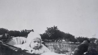 Manor Road East, Toronto, Ontario. Image shows a baby in a stroller with the street view in the ...