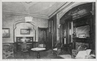 Image shows an interior of the sitting room.