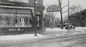  Image shows the front windows of the drug store that is located on the ground floor of a two s ...