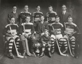 North Toronto Hockey Club. Image shows ten men and one child in two rows posing for a photo ind ...