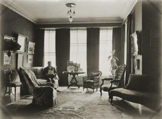 Wilkie, Daniel R., house, 432 Sherbourne St., west side, between Carlton & Wellesley Streets, INTERIOR, drawing-room, showing Wilkie reading