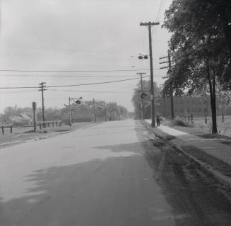 Denison Road E., looking east to railway crossing between Weston Road & Jane St., Toronto, Ontario