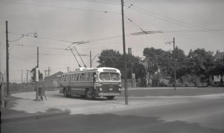 T.T.C., trolley bus #9084, at Oak Loop, Oak St., south side, east of Weston Road., Toronto, Ontario