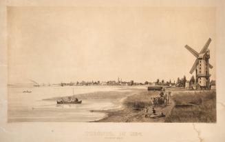 Image shows a few people on the shore with a mill in the background.