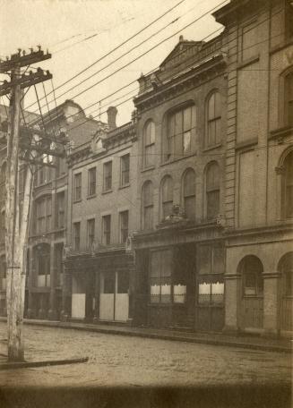 Colborne Street, north side, west from opposite of Scott Street, showing rear entrance of 'Golden Lion' shop
