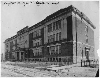 Image shows a three storey school building.