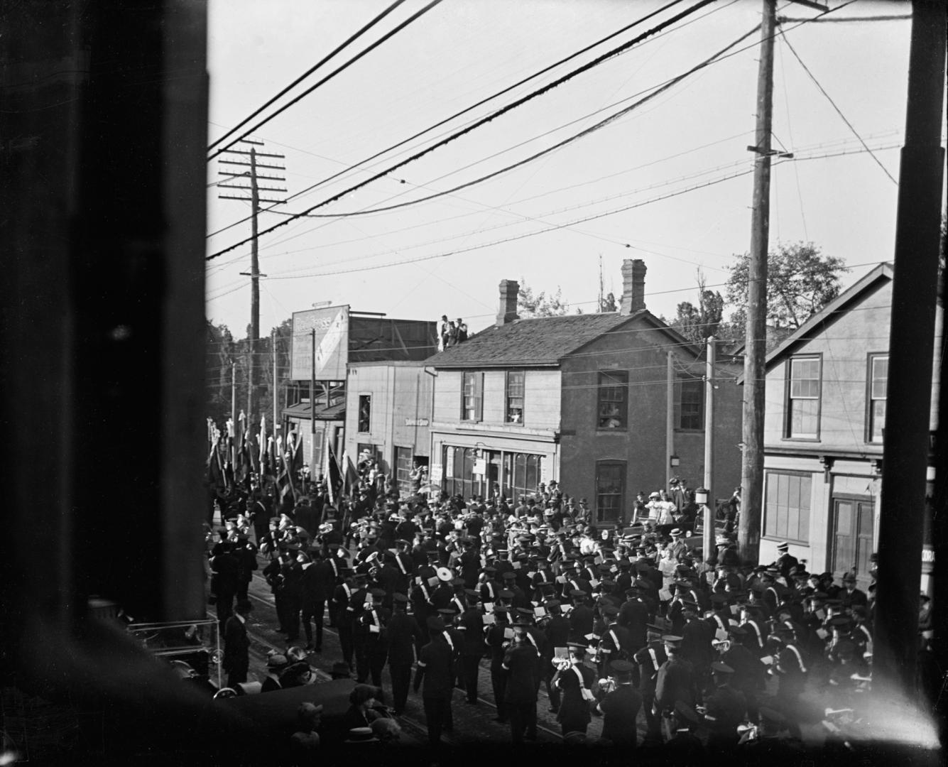 Salvation Army, funeral procession of victims of Empress of Ireland sinking, on Yonge Street, looking northeast to Baxter St. at right of centre