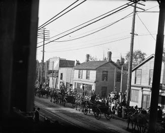 Salvation Army, funeral procession of victims of Empress of Ireland sinking, on Yonge Street, looking northeast to Baxter St. at right of centre