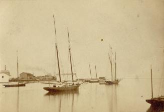 Image shows a few boats on the lake.