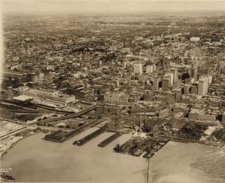 Image shows an aerial view of the lake and Toronto.