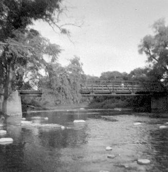Rowntree Mill Road Bridge over Humber River, Toronto, Ontario. Image shows a river view with th ...