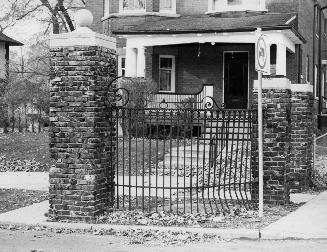 Gates on Alexandra Boulevard at Yonge Street, west side, Toronto, Ontario. Image shows the meta ...