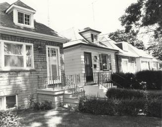 Houses, Bedford Park Avenue, north side, west of Greer Road, Toronto, Ontario. Image shows a ro ...