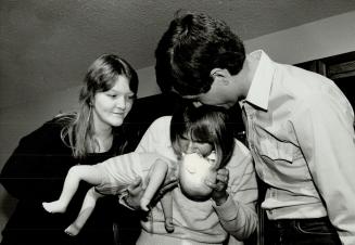 Breath of life: Using a specially designed doll, Kathy Banks learns resuscitation while Jayne Jussen and Bruce Banks watch